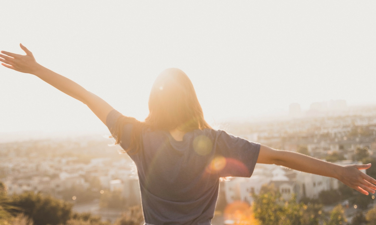 Student looks off the Loyola Marymount University bluff into the sunset.